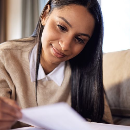 Shot of a beautiful young woman studying at home.